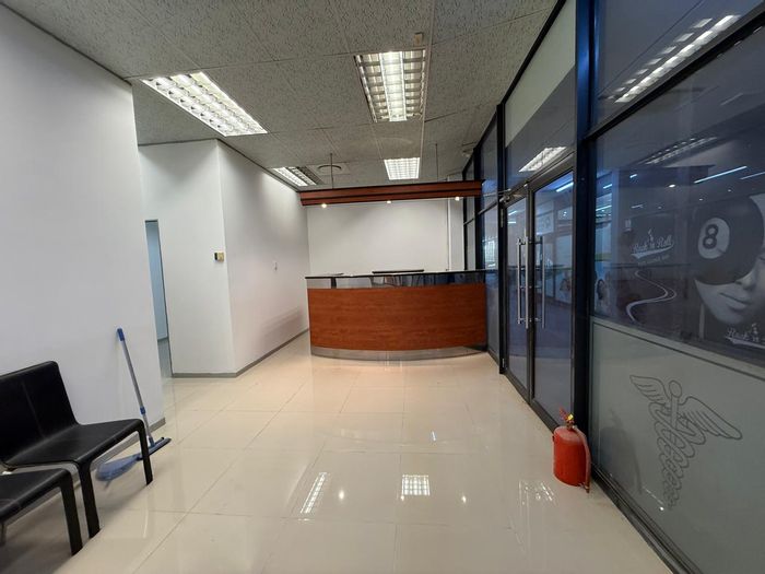 Umhlanga Central Apartment To Rent: Includes kitchenette, security, and parking amenities.