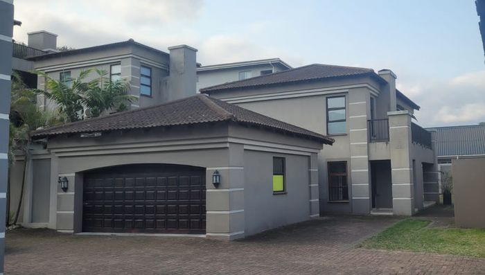 Amanzimtoti Central Townhouse For Sale: Beach access, open-plan living, double garage.