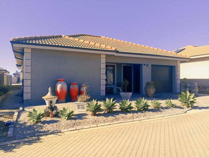 For Sale: Townhouse in Dana Bay with 2 en-suite bedrooms, garage, and garden.