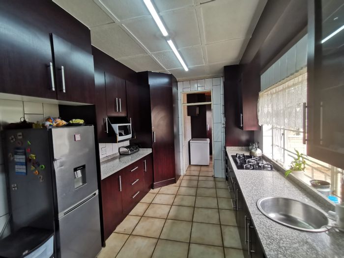Versatile 3-Bedroom House with Cottage and Borehole in Krugersdorp North, For Sale.