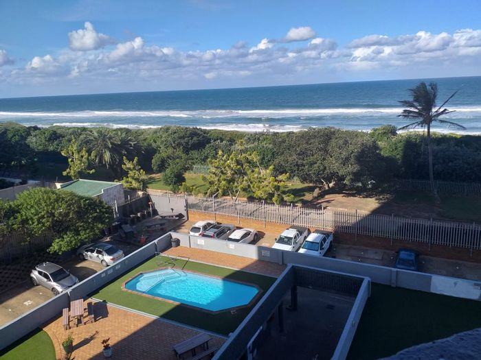 Amanzimtoti Apartment For Sale: 3-bed, sea views, pool, braai area, secure complex.