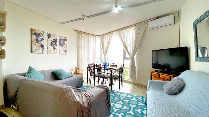 Beachfront apartment in Hibberdene Central for sale, with pool and direct beach access.