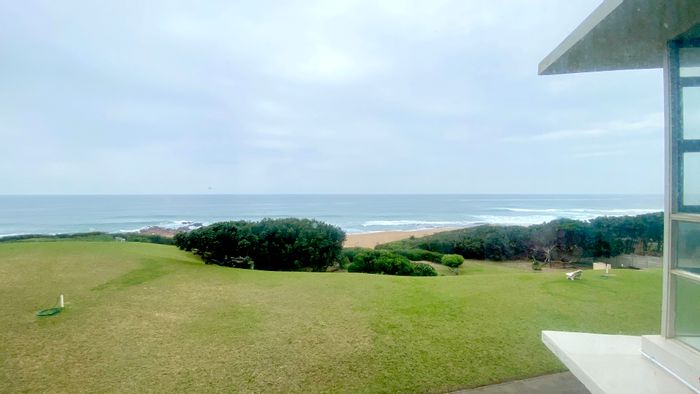 Beachfront Apartment For Sale in Hibberdene Central with sea views and amenities.