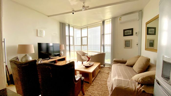 For Sale: Beachfront Apartment in Hibberdene Central with sea views, pool, and garage.
