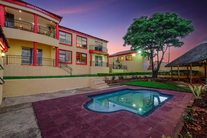 For Sale: Spacious Rangeview house with pool, balconies, and 2-bedroom flat.
