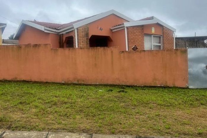 For Sale: House in Mdantsane with two bedrooms, flat, garage, and security.