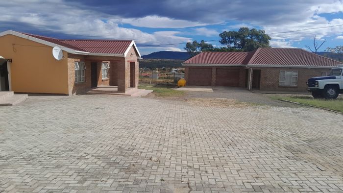 For Sale: 4-bedroom house in Bhisho Central with automated garage and paved grounds.