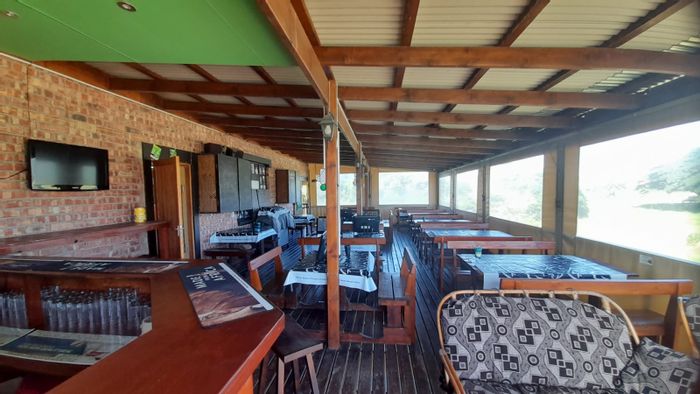 For Sale: Retail property in Paradise Beach with three businesses, parking, and security.