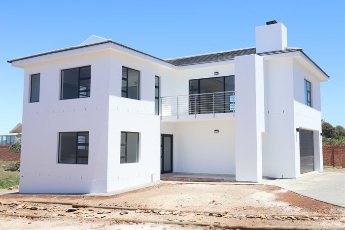 For Sale: House in Jeffreys Bay Central with ocean views, secure estate living.