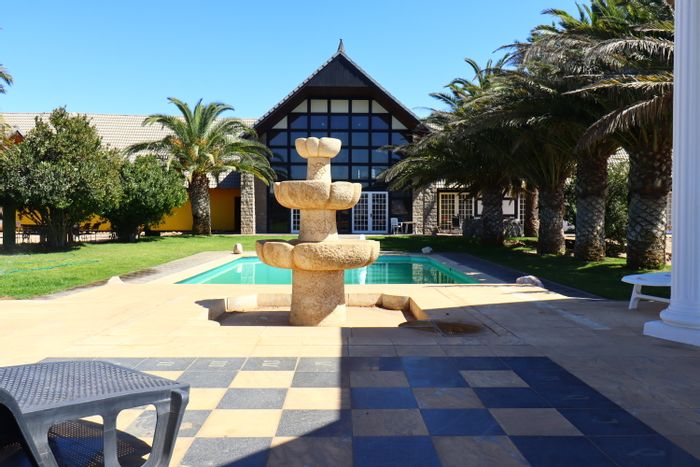 For Sale: River Plots Small Holding with pool, BBQ area, and multiple flats.