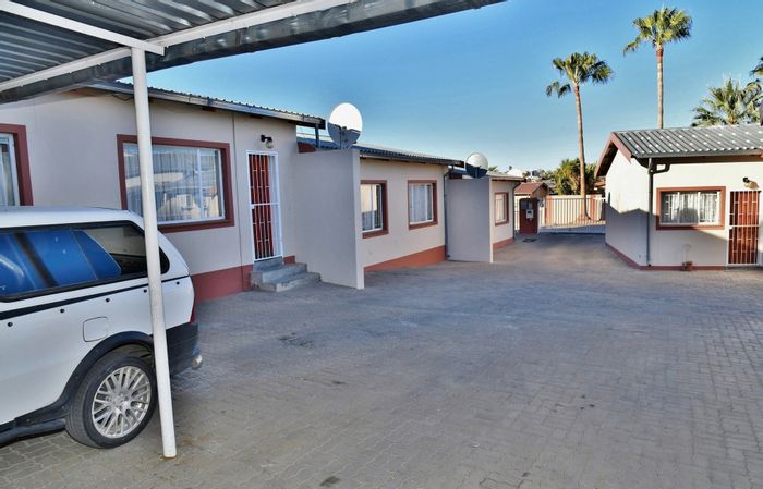For Sale: Pioneers Park Townhouse Complex with 5 rental units and security features.