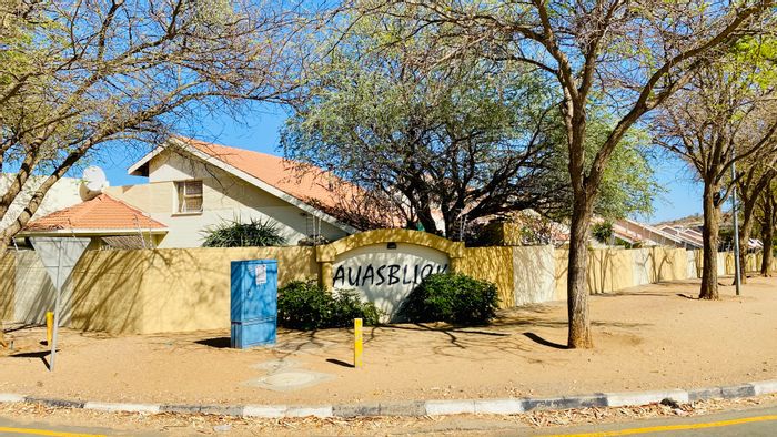 For Sale: 3-Bedroom Townhouse in Olympia with secure parking and private courtyards.