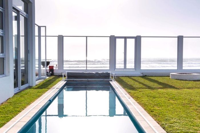 Vogelstrand Guest House For Sale: Beachfront, pool, en-suite rooms, investment potential.