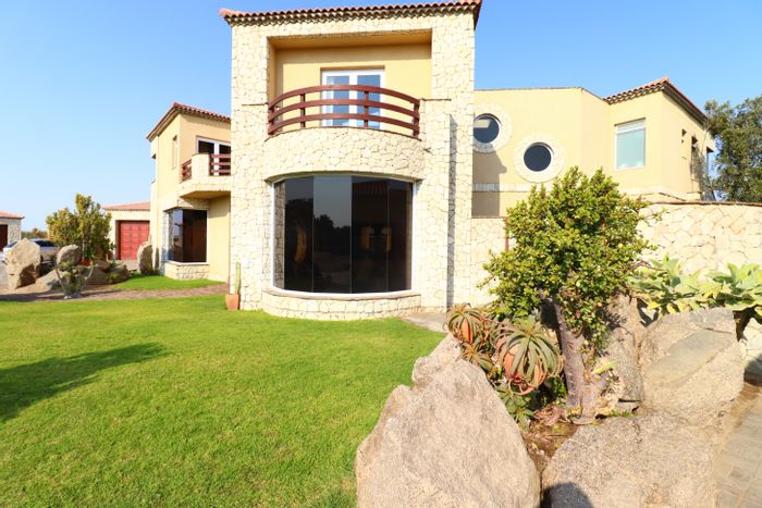 For Sale: House in Rossmund Golf Estate with indoor pool, flats, and golf views.