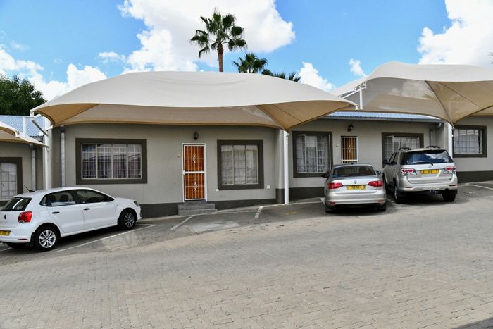 For Sale: Townhouse in Pioneers Park with 2 bedrooms, courtyard, and covered parking.