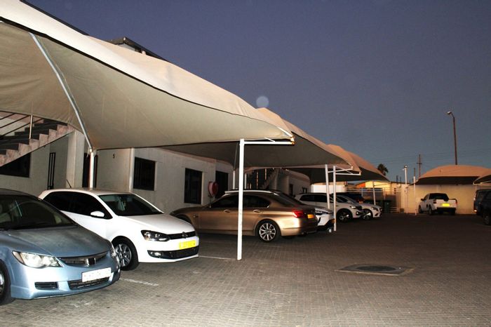 Khomasdal Apartment For Sale: 2 Bedrooms, open-plan living, secure parking, close to amenities.