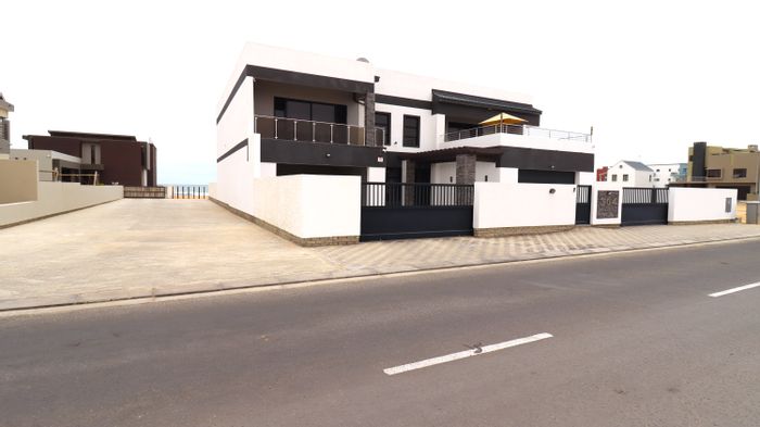 Beachside House for Sale in Mile 4: 5 Bedrooms, Guest Apartment, Outdoor Amenities.
