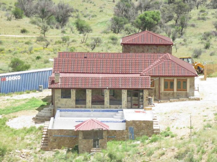 Daan Viljoen House For Sale: Secure estate, pool, guest house, and expansive views.