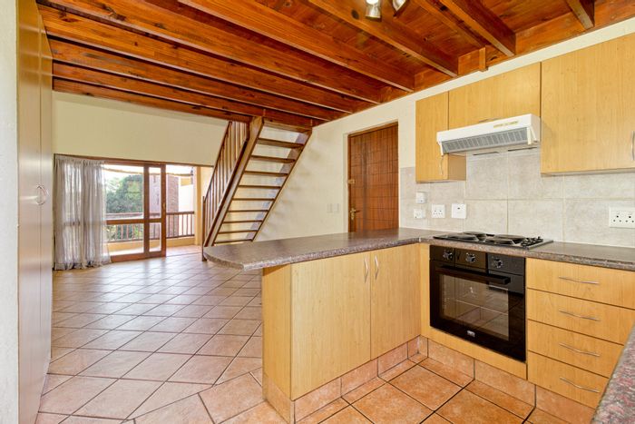For Sale: Two-bedroom apartment in Douglasdale with clubhouse, pools, and balconies.
