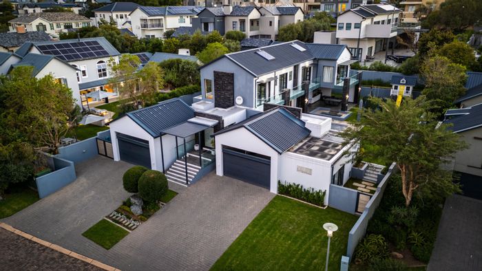 For Sale: House in Helderfontein Estate with pool, wine bar, and four garages.