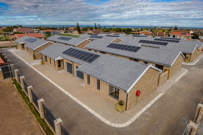 For Sale: Townhouse in C Place with off-grid living, garage, and security features.