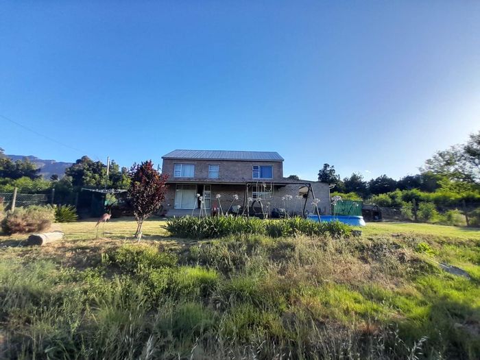 Barrydale House For Sale: Two-bedroom, double-storey home with garden and mountain views.