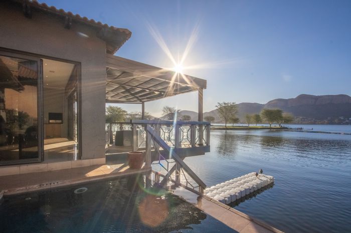 Lakeside House For Sale in Pecanwood Estate with private jetty and golf access.