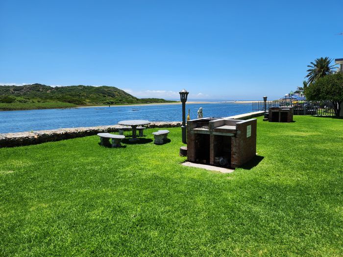 For Sale: Hartenbos Central Townhouse with river views, garage, and hotel amenities.