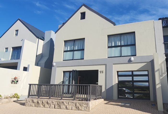 For Sale: Hartenbos Heuwels Townhouse with lagoon views, garage, and communal amenities.