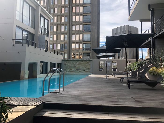 Apartment For Sale in Cape Town City Centre with rooftop pools, gym, and secure parking.