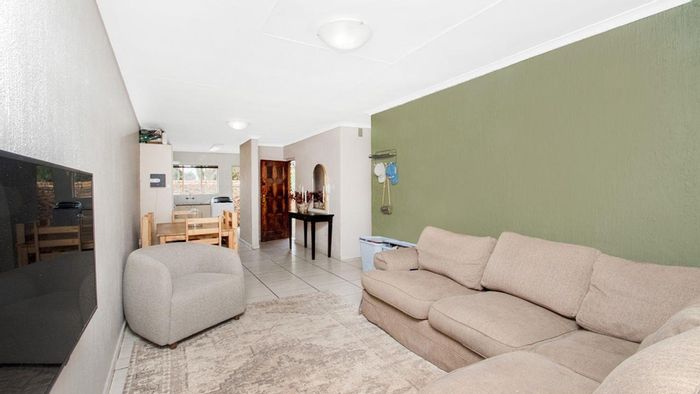 For Sale: Townhouse in Roodekrans with garden, pool, and secure parking.