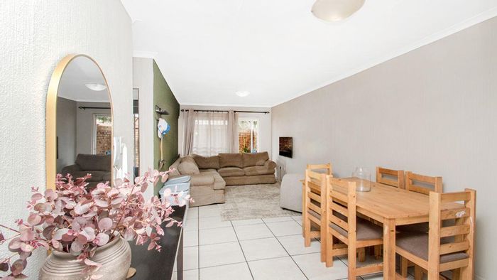 For Sale: Townhouse in Roodekrans with garden, pool, and secure parking.