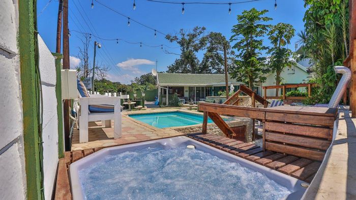 For Sale: House in Queensburgh Central with 9 rooms, pool, and koi pond.