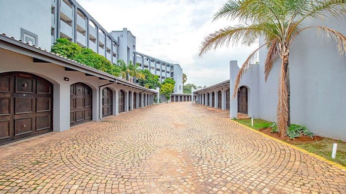 For Sale: Menlyn Apartment with 3 Bedrooms, Courtyard, Garage, and Prime Location.