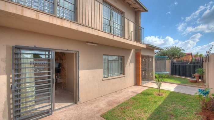 For Sale: House in Lenasia with 3 bedrooms, double garage, and security features.