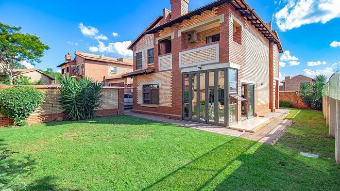 For Sale: Townhouse in The Wilds with solar power, private garden, and clubhouse access.