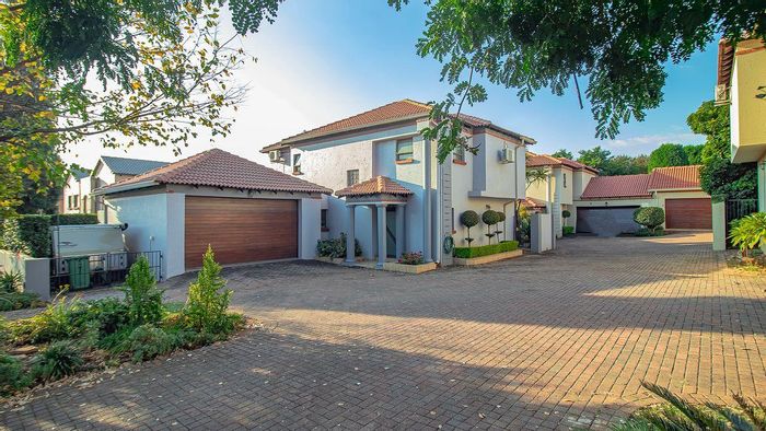 For Sale: Townhouse in The Wilds with security, clubhouse, pool, and solar panels.
