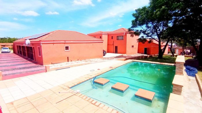 For Sale: House in Glen Austin AH with 21 cottages, pool, and solar panels.