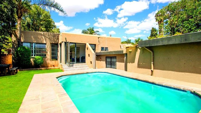 For Sale: House in Strijdompark with pool, triple garage, and spacious living areas.