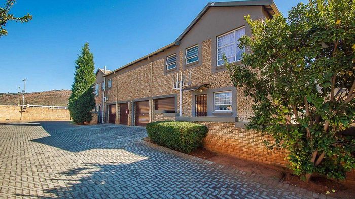 For Sale: Wilgeheuwel Townhouse with double garage, pet-friendly garden, and low levies.