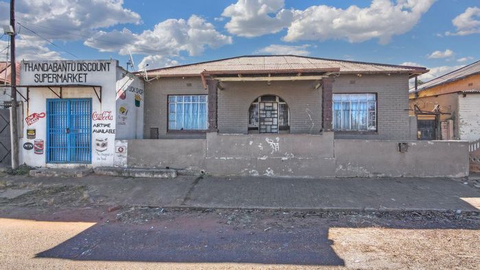 For Sale: 12-bedroom house in Jeppestown, fully tenanted with rental income.