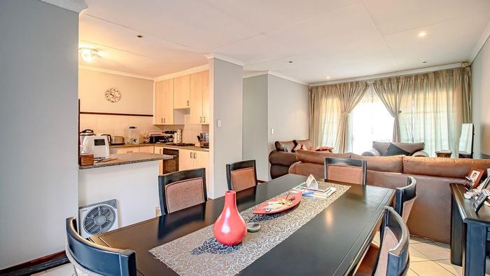 Equestria Townhouse For Sale: 2 beds, double garage, garden, open-plan living.