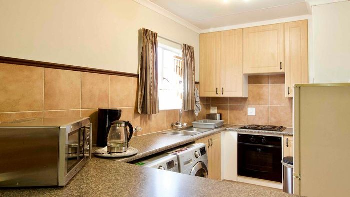 Mooikloof Ridge Apartment For Sale: 2 beds, 2 baths, double garage, secure estate.