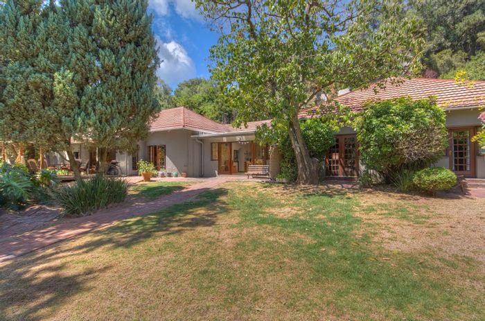 For Sale: Spacious 4-bedroom house in Mountain View with pool, garages, and guest units.