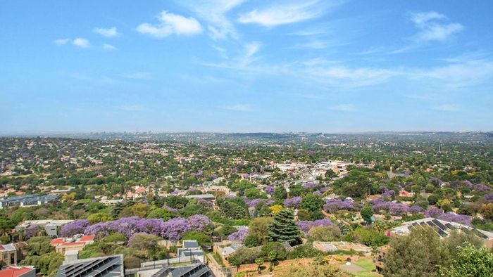 Northcliff Apartment For Sale: Open-plan living, balcony views, secure complex amenities.