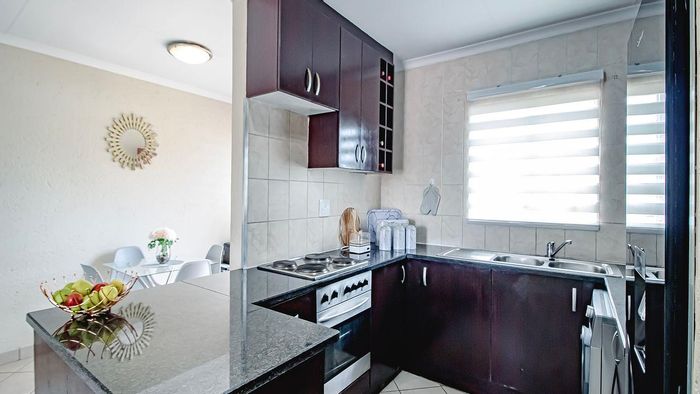 For Sale: 2BR Apartment in Theresapark with garage, security, and communal play area.