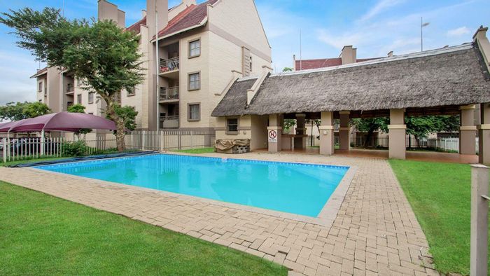 Sundowner Apartment For Sale: Open-plan living, private pool, and city views.