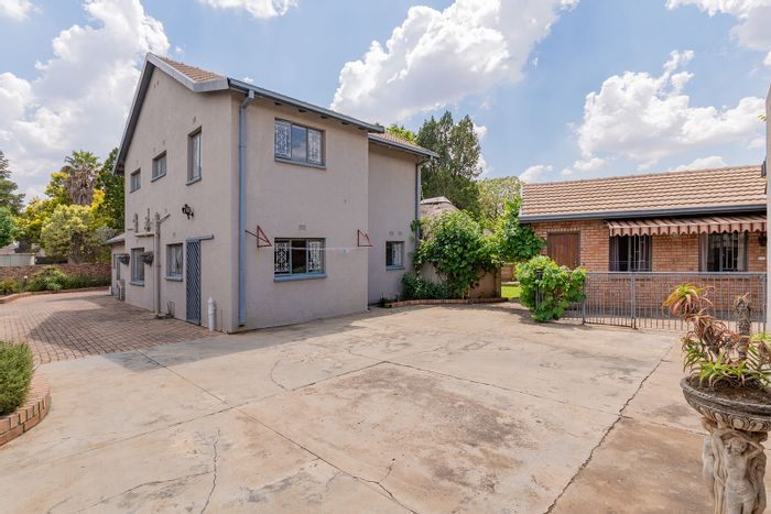 For Sale: Spacious Allen Grove house with cottage, double garage, and office space.