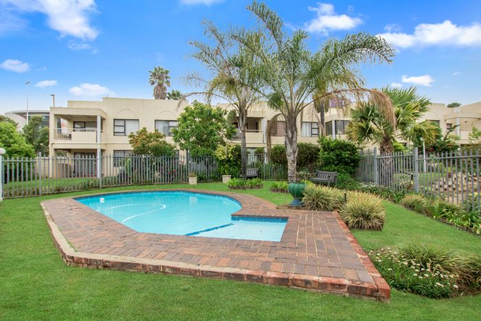 For Sale: 2-Bedroom Townhouse in Weltevreden Park with pool, balcony, and private garden.