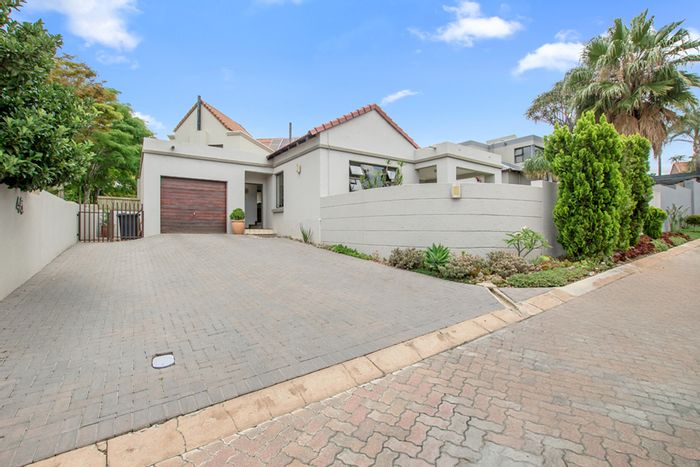 For Sale: House in Magaliessig with garden, patio, and kids' play area.